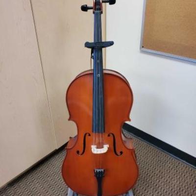 1046	
Cello with Bow and Stand
Measures approx 43