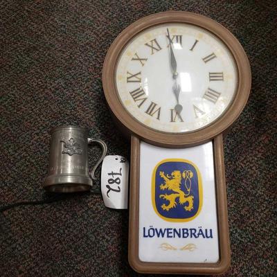 
#782 â€¢ Lowenbrau Plastic Lighted Clock and Budwiser Metal Golf Award