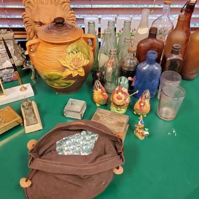 564	
Vintage Soda Bottles, Figurines, Candle Holders and More
Also includes jewlery boxes, bag of marbles, decor and more