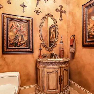 Bathroom with fine art and crosses 