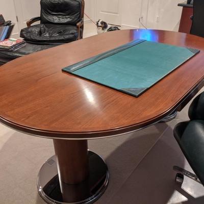 Oval shape, wood top, chrome pedestal leg desk.:
$895