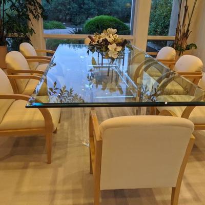 Dining Table with 10 chairs upholstered in silk. (there is wear on the seats).  Table dimensions 108