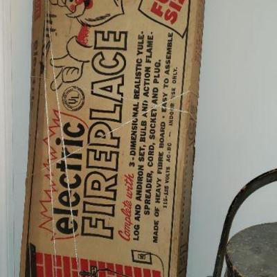 Vintage "electric" Fireplace-for houses without a chimney for Santa.  Glows with the use of a lightbulb.