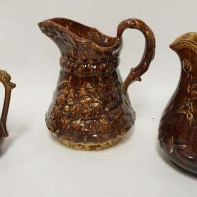 1134	GROUP OF 3 ANTIQUE BROWN GLAZED PITCHERS, TALLEST IS 8 3/4 IN
