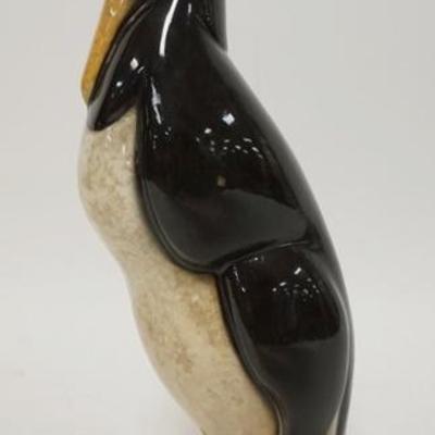 1114	UNUSUAL PENGUIN BOTTLE, HAS MAKERS MARK & #735, HAS SOME STAINING, METAL TOP HAS A ACORN, 12 1/4 IN HIGH
