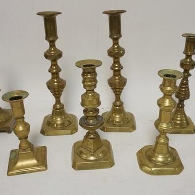 1142	10 ANTIQUE BRASS CANDLESTICKS, LOT INCLUDES PAIRS & PUSH UP, TALLEST IS 10 3/4 IN
