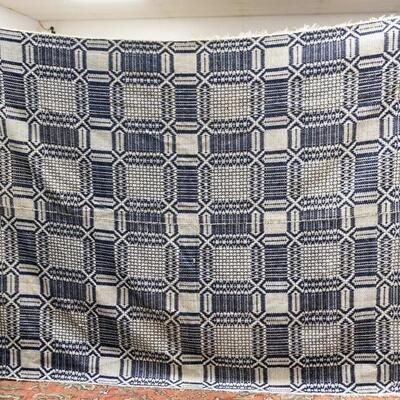 1233	BLUE AND WHITE COVERLET, HAS SOME DAMAGE
