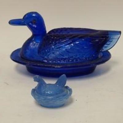 1145	4 COLORED GLASS COVERED HEN & DUCK DISHES, LARGEST IS 8 IN LONG
