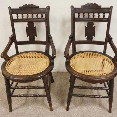 1128	PAIR OF CANED SEAT CARVED VICTORIAN CHAIRS
