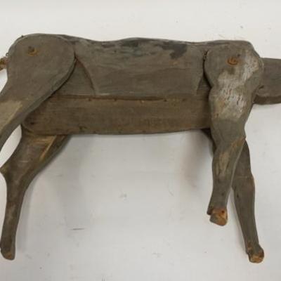 1033	JOINTED FOLK ART WOODEN DONKEY, NECK, HEAD, & LEGS ARE JOINTED, 20 IN LONG, TAIL IS A BRAIDED ROPE
