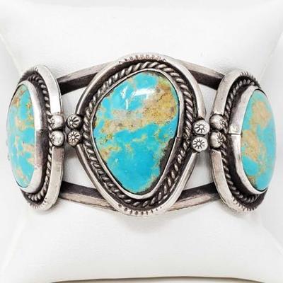 2004	

Sterling Silver Native American Turquoise Cuff Bracelet- 57.8g
Weighs Approx 57.8g
Includes 3 Genuine Turquoise Stones 
Approx...