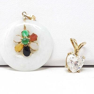 2 14k Gold Gold Pendants, 5.6g
Weighs Approx 5.6g