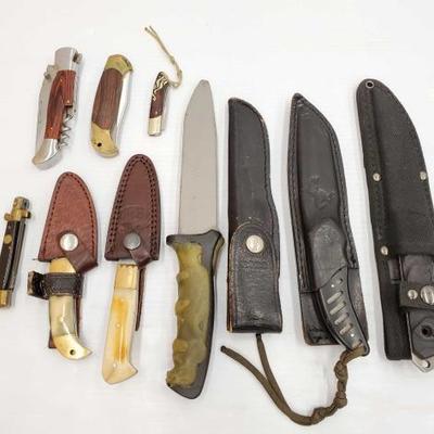 1034	

6 Knives With Sheaths and 4 Pocket Knives
Blades Measures Approx 2.5