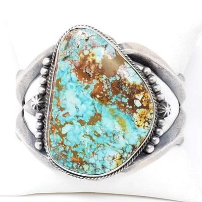 2010	

Sterling Silver Cuff Bracelet With Large Turquoise Stone, 117.8g
Weighs Approx 117.8g,
Large Genuine Turquoise 
Approx 2"...