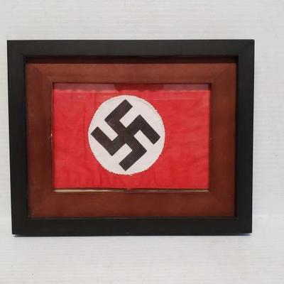 7064	

Framed Nazi Swastika Armband
This lot contains a framed Nazi Swastika Armband