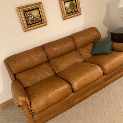Leather sofa, with a couple grand kid signatures with markers 
