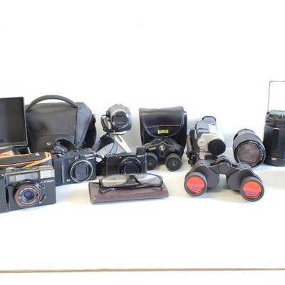 
#5510 • 3 Digital Cameras, 2 Binoculars, Camera Cases, Video Cameras, And More