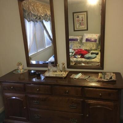 Dresser with wall hanging mirrors 