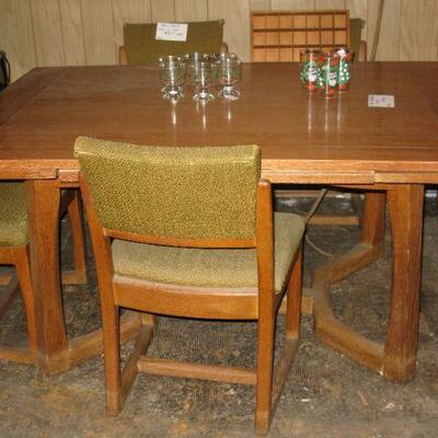 MCM dining room table refracting sides   buy it now $ 135.00    
matching Chairs BUY IT NOW  $ 20.00 EACH
