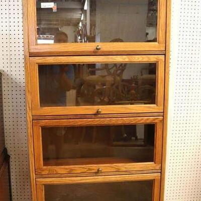 
Lot 512
Antique style oak faux 6 stack leaded glass bookcase
