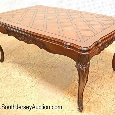 
Lot 527
BEAUTIFUL country French carved parquet top dining room table with refectory leaves in the mahogany and oak
