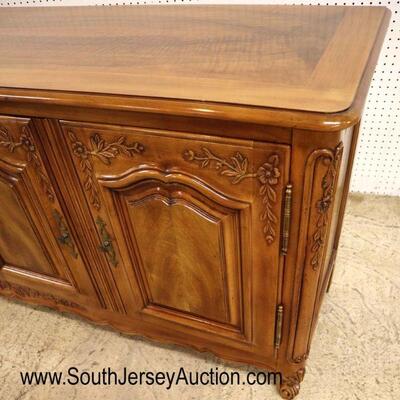 
Lot 503
John Widdicomb VERY CLEAN 4 door fitted country French carved buffet in the walnut and mahogany
