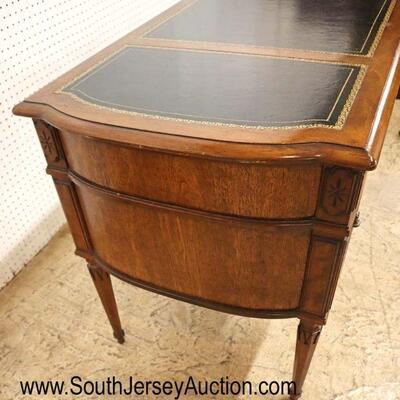 
Lot 516
VINTAGE walnut leather top desk in the manner of Baker Furniture
