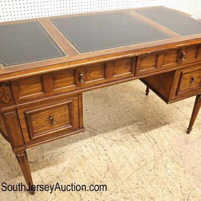 
Lot 516
VINTAGE walnut leather top desk in the manner of Baker Furniture
