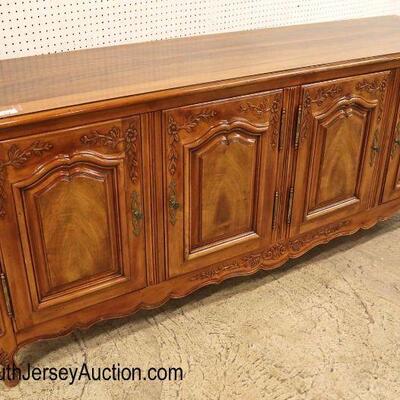 
Lot 503
John Widdicomb VERY CLEAN 4 door fitted country French carved buffet in the walnut and mahogany
