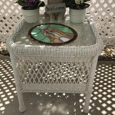 Plastic wicker table with glass top $22