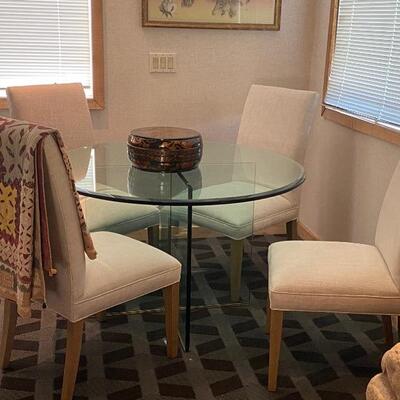 Glass table top with four chairs $975 size 34”round 