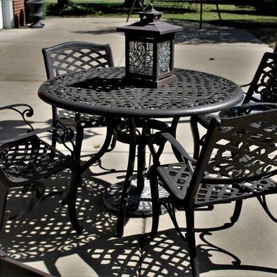 Fantastic five piece outdoor metal dining set with umbrella hole and stand.
