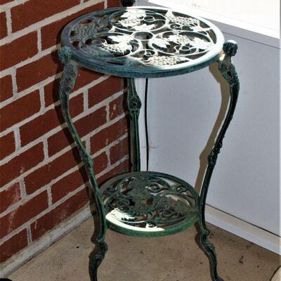Iron outdoor plant stand or accent table.