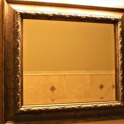 Large decorative framed mirror.