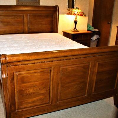 Beautifully crafted, solid oak, queen size sleigh bed.  Incredible condition.