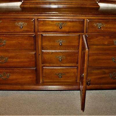 Center of the dresser features three lingerie drawers.