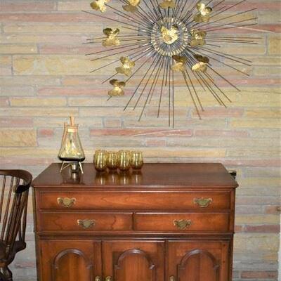 A beautiful Vintage Cherry wood Pennsylvania House Buffet settled nicely beneath a mid century Art Piece made specifically for her house....