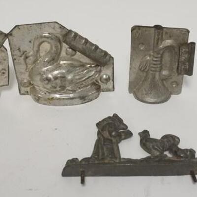 1100	FOUR AND A HALF CHOCOLATE MOLDS; TWO SWANS A HORN, ROOSTERS & A HALF MOLD W/ A FOX READING TO CHICKENS SWANS ARE 4 IN X 4 IN 	50	100...