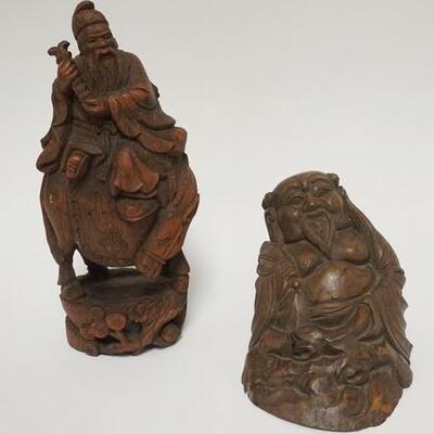 1059	5031	2 ASIAN WOOD CARVINGS	TWO ASIAN WOODEN CARVINGS MAN ON A HORSE & SEATED MAN TALLEST IS 11 3/4 IN & HAS A SPLIT IN THE BASE 	70...