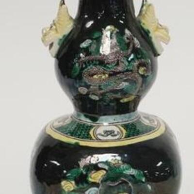 1057	5031	ASIAN VASE W/ DRAGONS	ASIAN VASE DECORATED W/ DRAGONS & FLOWERS ON A BLACK GROUND HAS ANIMAL HEAD HANDLES 8 3/4 IN H 	50	100	20...