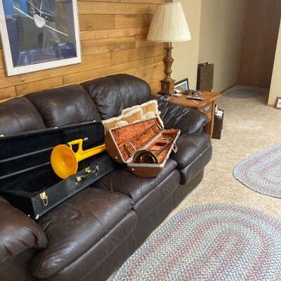 Leather couch and Olds trombone