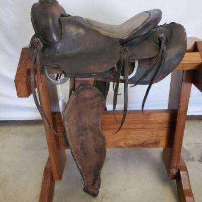 280	

Ole Cowboy Western Saddle
14 1/2" Ole cowboy western saddle.  Vintage conchos.  Needs parts and repairs.  Great home decor.