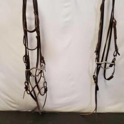 156	

Two complete Bridles with Curb Bits
Two complete Used Bridles with Curb Bits