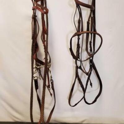 189	

Two Complete English Bridles with Cavason and Misc English Tack
Two Complete English Bridles with cavason. Also miscellaneous...