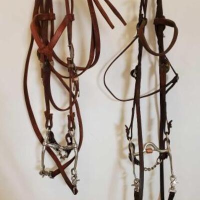 524	

2 Complete used Bridles
2 Complete Used Bridals:
1- Browband Headstall With Silverado Buckles And Tips Silver Overlay With...