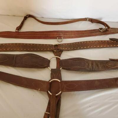 400	

Four Cowboy Breast Collars Galore
4 Breast Collars Galore.  Nice used harness leather breast collars.  One has buck stitching....