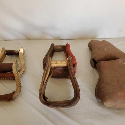 414	

Two Sets of Cowboy Stirrups and a set of Kids Tapaderos
Two Sets of Cowboy Stirrups and a set of Kids Tapaderos