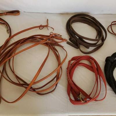 409	

Roping and Split Cowboy Reins
Mixed lot of Split and roping reins all in one lot. Harness leather and nylon.
 	 	 	 	 	 