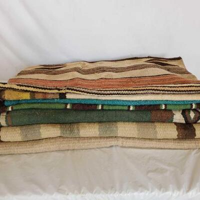 168	

7- Misc Navajo Horse Saddle Pads and Blankets
7- Misc Navajo Horse Saddle Pads and Blankets
May have some old Navajos in this stack
