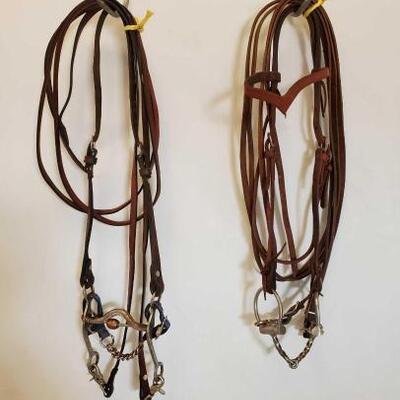 523	

2 Complete Used Bridles
2 Complete Used Bridals:
1 Correction Bit With Copper Roller,  No Ear Headstall
1 Browband Headstall With...